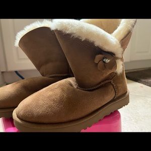 Ugg boots with flower on side.  Tan color sz 9